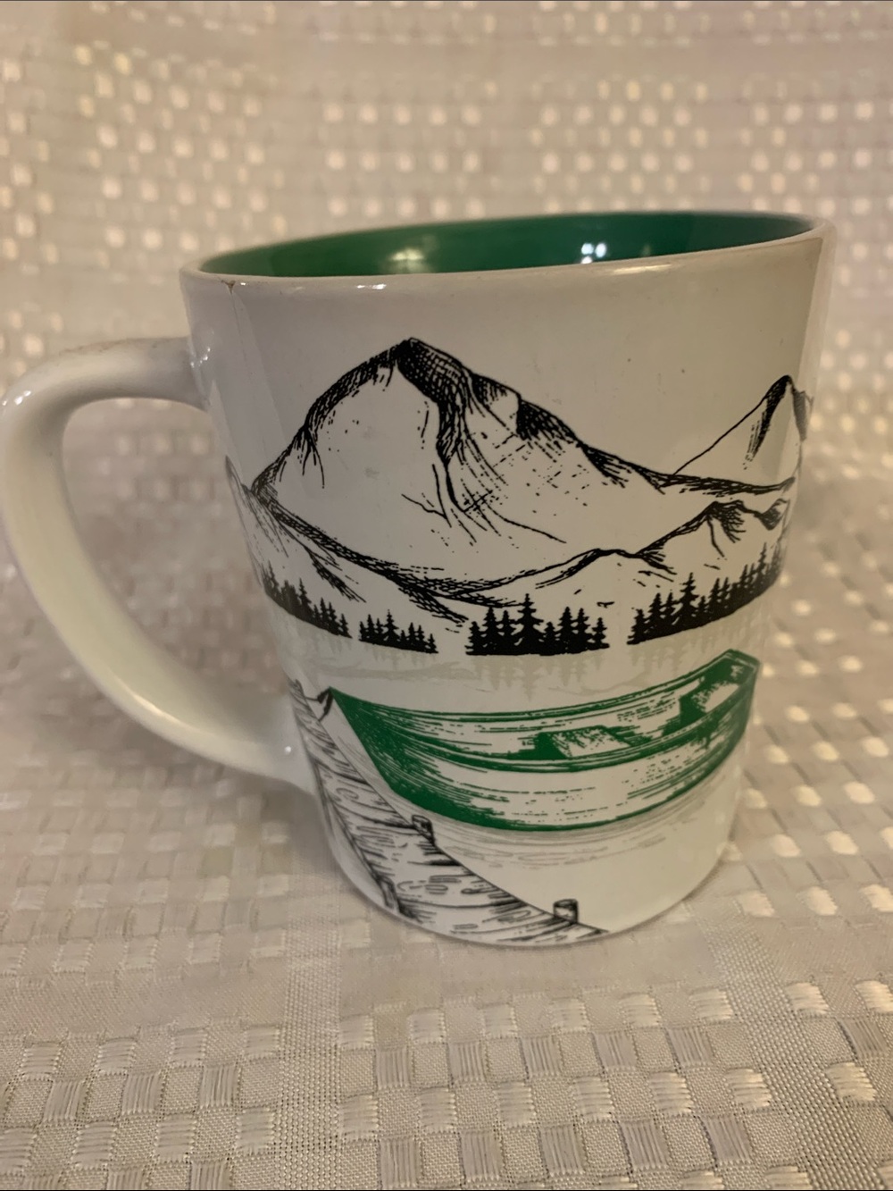 Tim Hortons white mug with canoe and mountain design and green inside mug. 2018.
